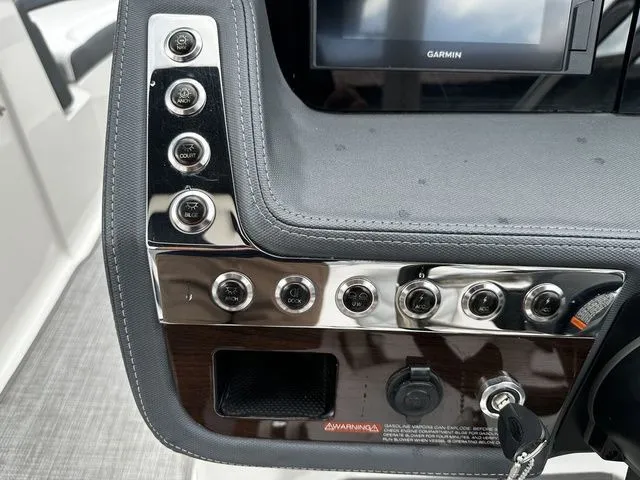Slide: The Image of Control panel of 2019 Chaparral 277SX boat with switches and Garmin display. - 20