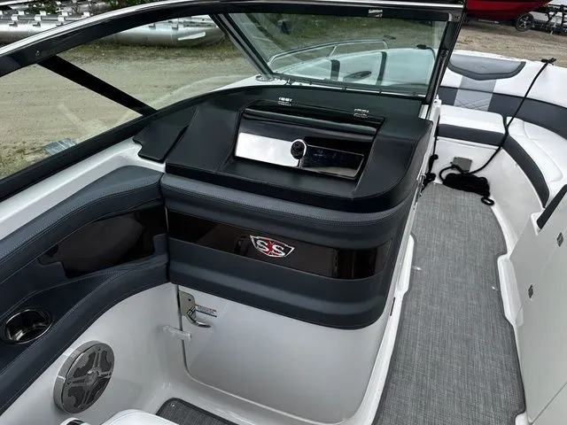 Slide: The Image of 2019 Chaparral 277SX boat interior with sleek dashboard and seating area. - 21