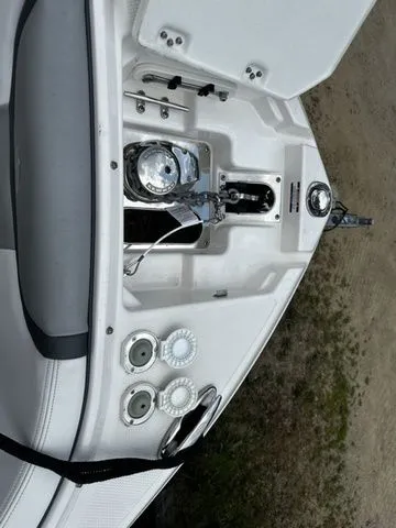 Slide: The Image of 2019 Chaparral 277SX boat anchor compartment with winch and cleats. - 27