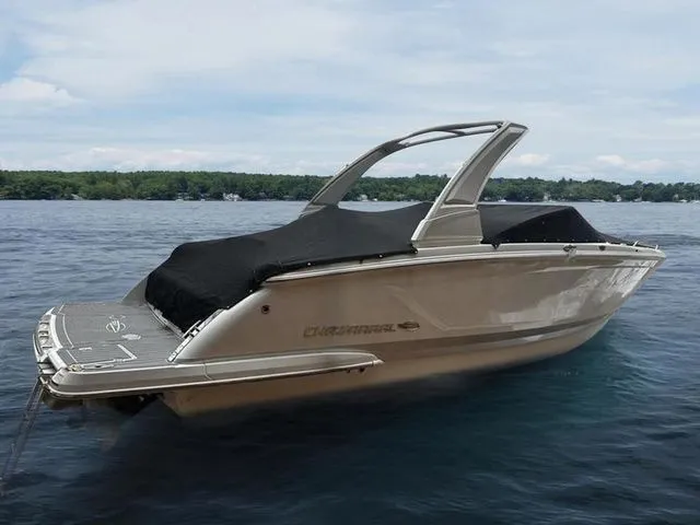 Slide: The Image of 2019 Chaparral 277SX boat on a lake with a black cover. - 3