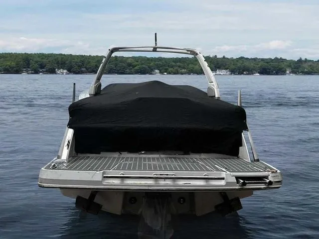 Slide: The Image of 2019 Chaparral 277SX boat with cover on a lake. - 4
