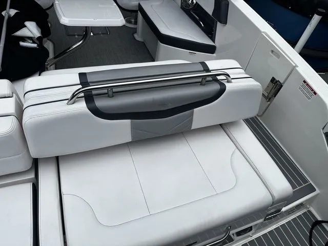Slide: The Image of 2019 Chaparral 277SX boat interior with white seating and sleek design. - 8