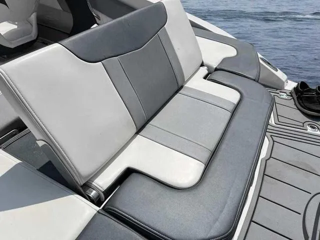 Slide: The Image of 2021 Chaparral 21 SSI Sport boat seat with gray and white upholstery. - 13