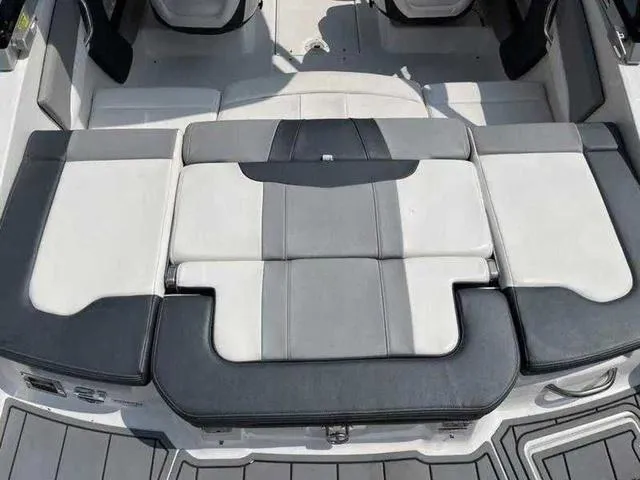 Slide: The Image of 2021 Chaparral 21 SSI Sport boat interior with gray and white seating. - 15