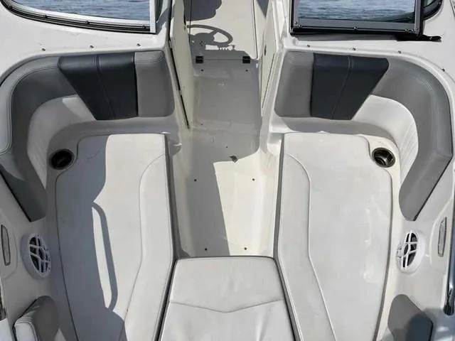 Slide: The Image of Interior of 2021 Chaparral 21 SSI Sport boat with gray and white seating. - 26