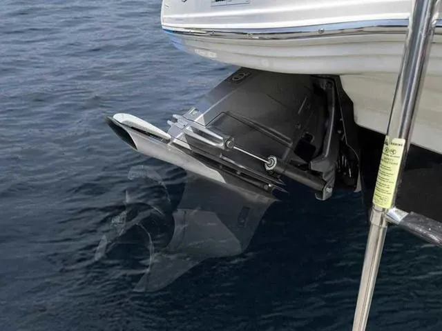 Slide: The Image of 2021 Chaparral 21 SSI Sport boat engine in water, showcasing sleek design and functionality. - 8