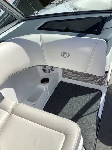 Slide: The Image of 2016 Cobalt 200S boat interior with white seating and carpeted flooring. - 11