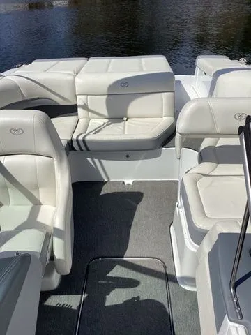 Slide: The Image of 2016 Cobalt 200S boat interior with white leather seating and gray carpet. - 14