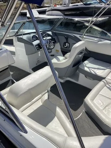 Slide: The Image of 2016 Cobalt 200S boat interior with white leather seating and modern dashboard. - 3