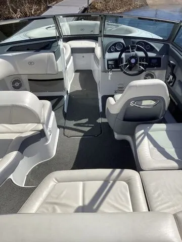 Slide: The Image of 2016 Cobalt 200S boat interior with white leather seating and modern dashboard. - 5