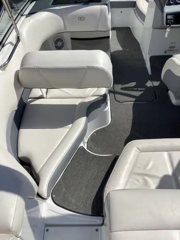 Slide: The Image of 2016 Cobalt 200S boat interior with white leather seating and gray carpet. - 6