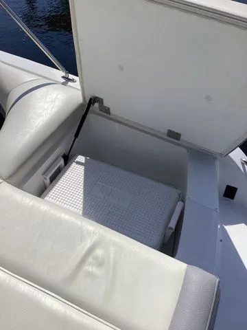 Slide: The Image of 2016 Cobalt 200S boat with open storage compartment and cooler. - 7