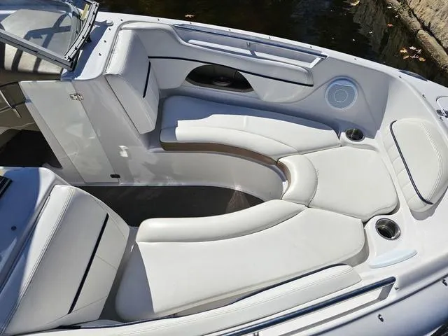 Slide: The Image of 2007 Four Winns Horizon 220 boat interior with white seating and cup holders. - 10