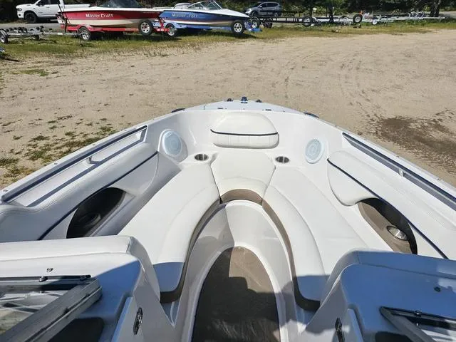 Slide: The Image of 2007 Four Winns Horizon 220 boat interior with white seating and cup holders. - 5