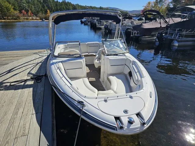 Slide: The Image of 2007 Four Winns Horizon 220 boat docked on a serene lake. - 8