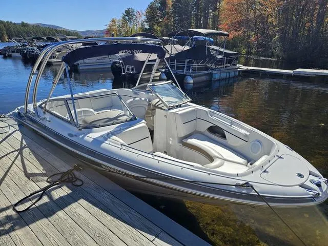 Slide: The Image of 2007 Four Winns Horizon 220 boat docked on a sunny day with autumn trees. - 9