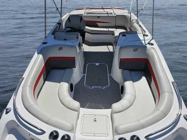 Slide: The Image of 2019 Hurricane 188 I/O boat interior with spacious seating and sleek design on calm water. - 2