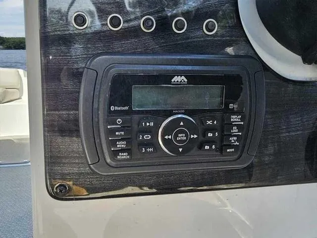 Slide: The Image of Control panel of a 2019 Hurricane 188 I/O boat with audio system. - 9