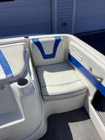 Slide: The Image of 2007 Bayliner HSP 190 boat interior with white and blue seating. - 10