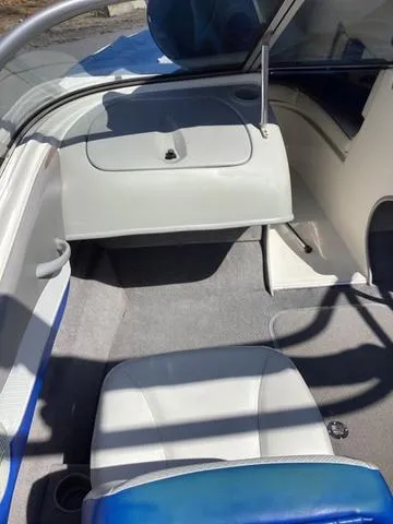 Slide: The Image of 2007 Bayliner HSP 190 interior with seating and storage compartment. - 12