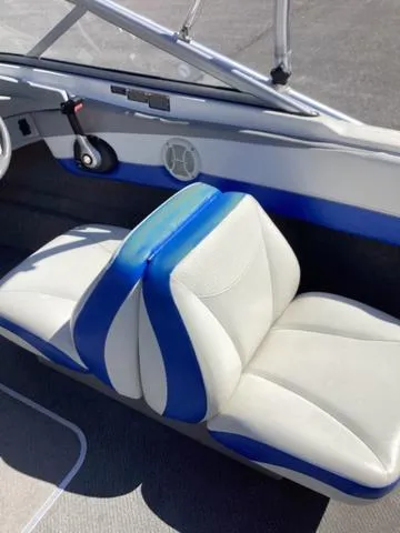 Slide: The Image of 2007 Bayliner HSP 190 boat interior with blue and white seating. - 13