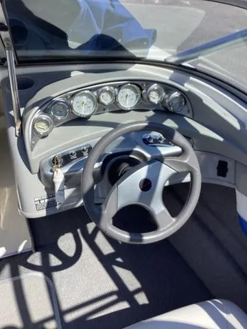 Slide: The Image of 2007 Bayliner HSP 190 dashboard with steering wheel and gauges. - 14