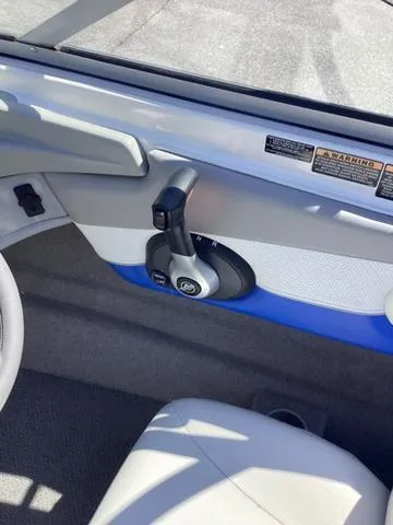 Slide: The Image of Interior view of a 2007 Bayliner HSP 190 boat, featuring control panel and seating. - 15