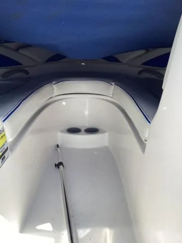 Slide: The Image of 2007 Bayliner HSP 190 boat interior with white seating and blue accents. - 16