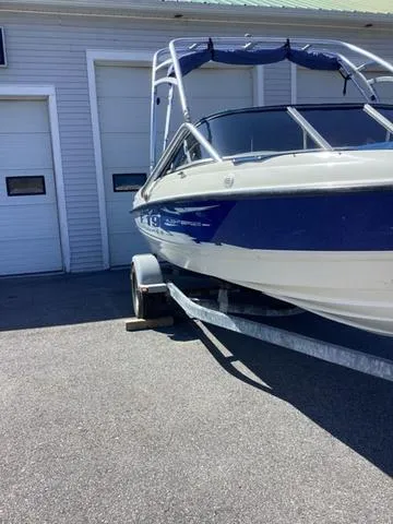 Slide: The Image of 2007 Bayliner HSP 190 boat on trailer, parked outside a garage. - 5