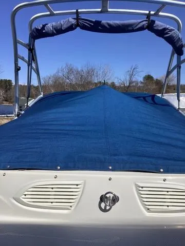 Slide: The Image of 2007 Bayliner HSP 190 boat with blue cover and canopy, outdoors. - 6