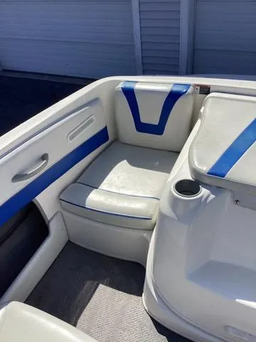 Slide: The Image of 2007 Bayliner HSP 190 boat interior with blue and white seating. - 9