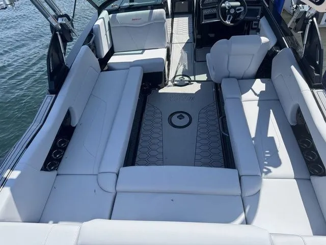 Slide: The Image of 2024 MasterCraft NXT23 boat interior with spacious seating and modern design. - 10