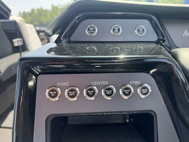 Slide: The Image of Control panel of 2024 MasterCraft NXT23 boat with ballast fill and empty buttons. - 15