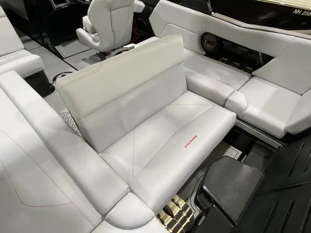 Slide: The Image of 2024 MasterCraft NXT23 boat interior with sleek, modern seating and premium upholstery. - 23