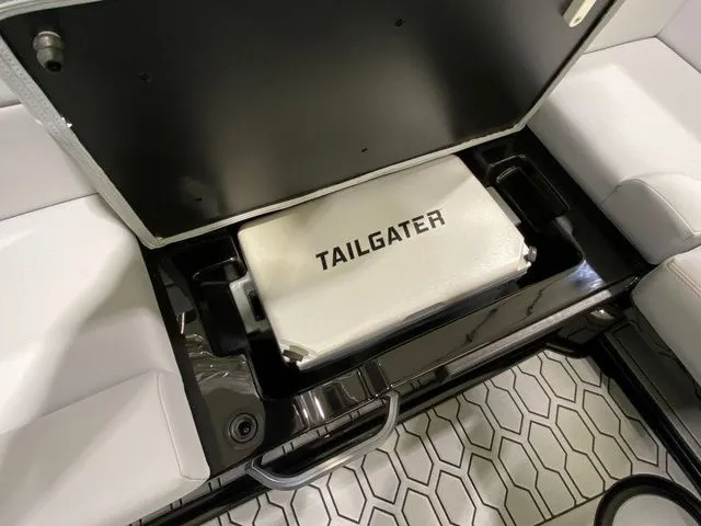 Slide: The Image of 2024 MasterCraft NXT23 boat storage with Tailgater cooler under seat. - 26