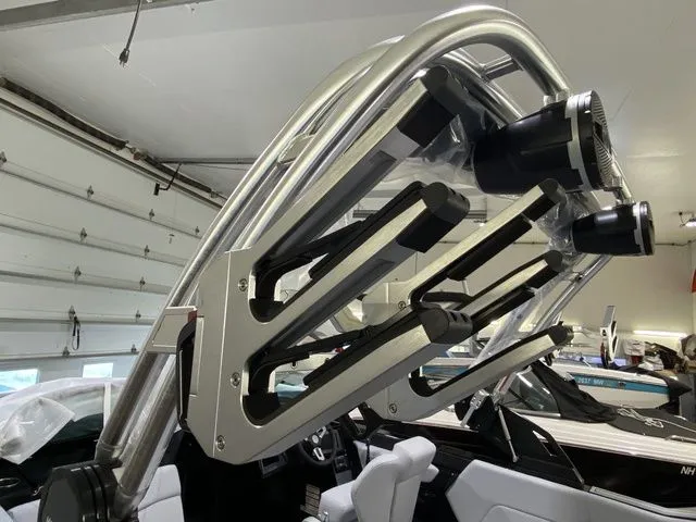 Slide: The Image of 2024 MasterCraft NXT23 wakeboard tower with speakers in a garage setting. - 27