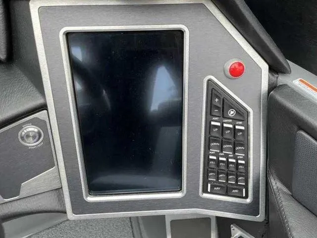 Slide: The Image of Control panel of 2024 MasterCraft X24 boat with touchscreen and buttons. - 17