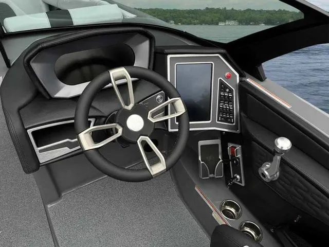 Slide: The Image of 2024 MasterCraft X24 boat cockpit with modern steering wheel and digital controls. - 19