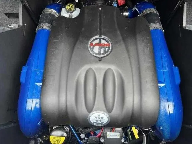Slide: The Image of 2024 MasterCraft X24 engine with blue accents and branded cover. - 21
