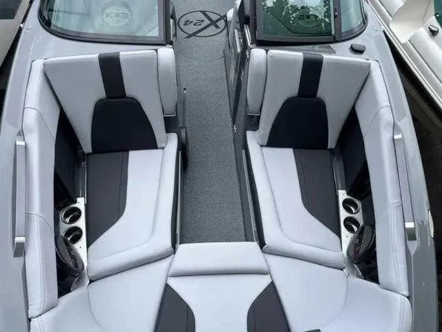 Slide: The Image of 2024 MasterCraft X24 boat interior with sleek gray and black seating design. - 24
