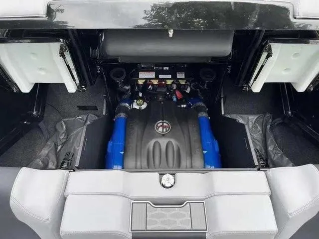 Slide: The Image of 2024 MasterCraft X24 engine compartment with blue accents and organized layout. - 8