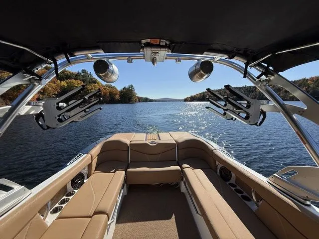 Slide: The Image of 2019 MasterCraft XT25 boat interior with lake view and autumn foliage. - 3