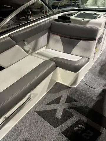 Slide: The Image of 2019 MasterCraft XT22 boat interior with gray and white seating. - 5
