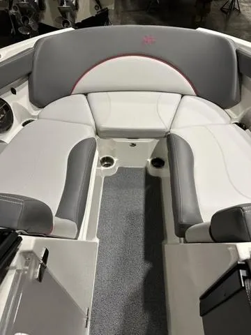 Slide: The Image of 2019 MasterCraft XT22 boat interior with gray and white seating. - 8
