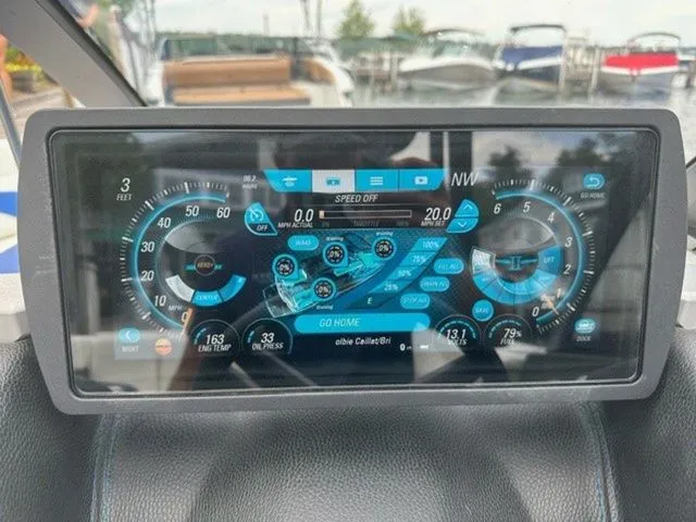 Slide: The Image of Dashboard of a 2017 Malibu 24 MXZ boat with digital gauges and controls. - 9