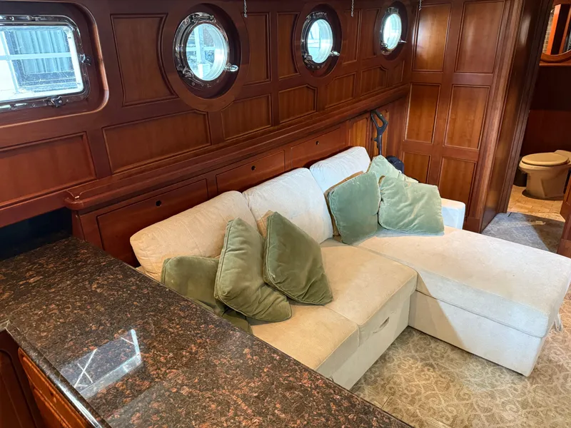 Slide: The Image of Luxurious interior of a 2009 Custom Dutch Canal Barge with plush seating and wooden paneling. - 11