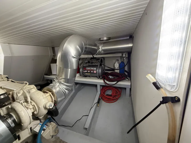 Slide: The Image of Engine room of a 2009 Custom Dutch Canal Barge with visible machinery and equipment. - 23