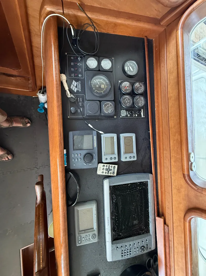 Slide: The Image of Control panel of a 2009 Custom Dutch Canal Barge with various navigation instruments. - 4