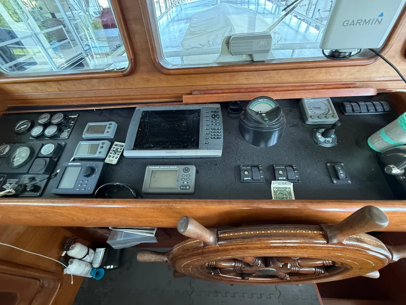 Slide: The Image of Cockpit of a 2009 Custom Dutch Canal Barge with navigation instruments and wooden steering wheel. - 6