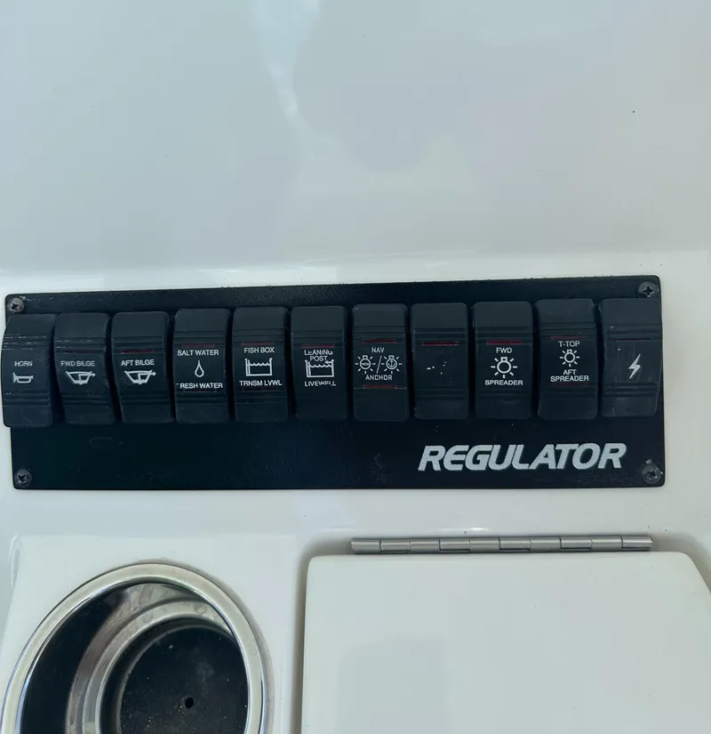 Slide: The Image of Control panel of a 2009 Regulator 32FS boat with labeled switches. - 15